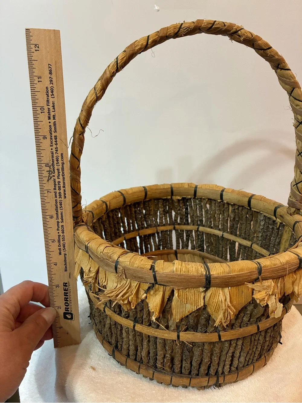 Handcrafted rustic corn husk and twig folk art basket